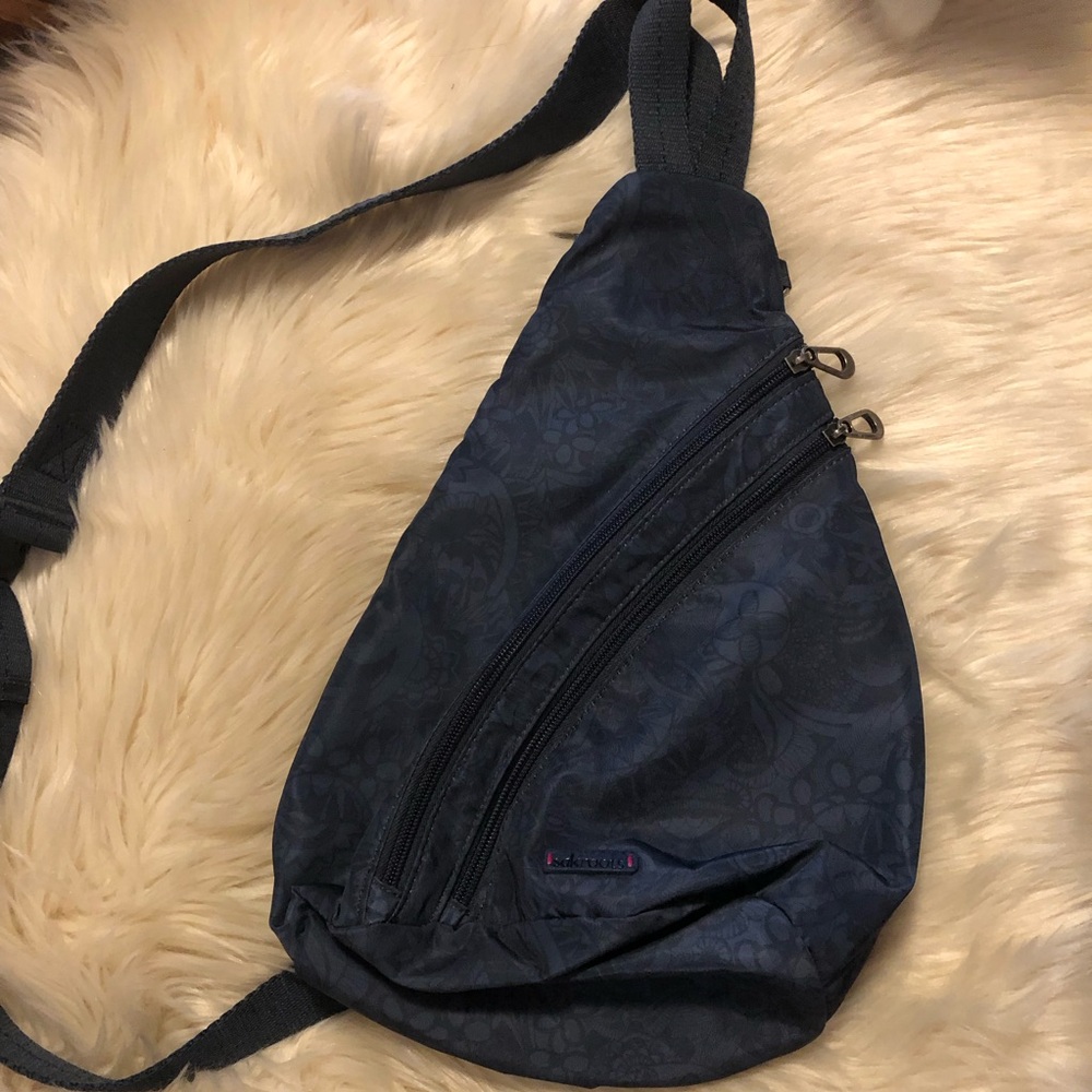 Sakroots on the go eco twill sling backpack in navy floral